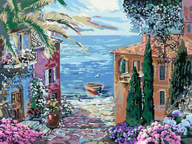 A vibrant jigsaw puzzle featuring a Mediterranean landscape. The artwork shows colorful coastal buildings, lush greenery, and a serene blue sea with a small boat. Bougainvillea and palm trees add to the picturesque scenery.