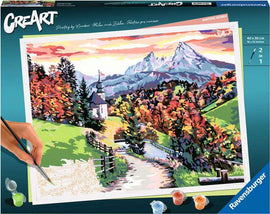 CreArt Beautiful Bavaria DIY painting kit featuring a scenic landscape with mountains, trees, and a church. Includes paint pots and brush for creating your own masterpiece.