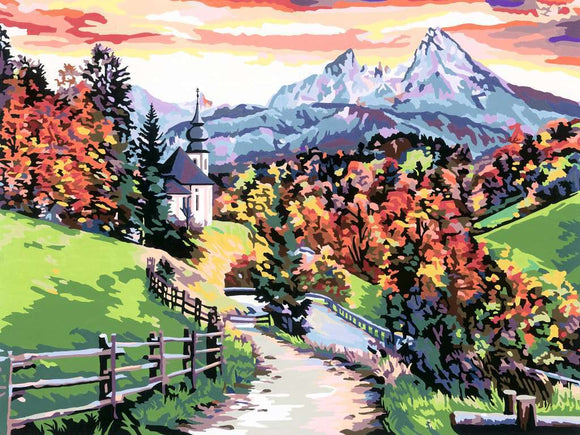 A picturesque scene showcasing the beauty of Bavaria with vibrant autumn foliage. The landscape features rolling hills, a charming church with a steeple, and majestic mountains in the background, all enhanced by a colorful sunset sky.