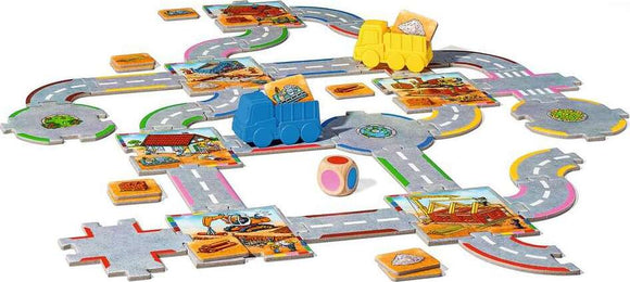 Big City Builders game by Ravensburger, featuring colorful wooden trucks and playful road tiles. The game includes a dice and various construction-themed tiles, allowing players to connect roads and create a bustling city layout, perfect for imaginative play. Ideal for young builders and families.