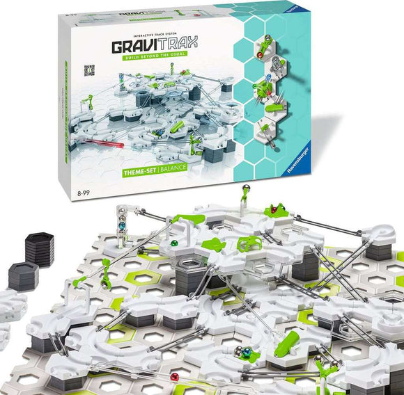 The GraviTrax Theme Set: Balance by Ravensburger features an interactive track system with a variety of innovative terrain pieces and balancing components. The set includes colorful marbles and connectors, allowing for creative construction and gravity-driven gameplay. The packaging is visibly displayed in the background, showcasing the engaging and educational nature of the product.