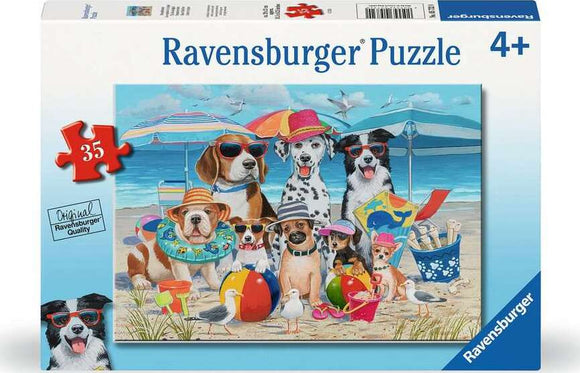 Ravensburger Beach Buddies 35-piece jigsaw puzzle featuring a colorful and whimsical beach scene with playful dogs wearing summer accessories such as sunglasses and hats. The puzzle depicts a variety of dog breeds enjoying a day at the beach, surrounded by beach toys and umbrellas, designed for children aged 4 and up.