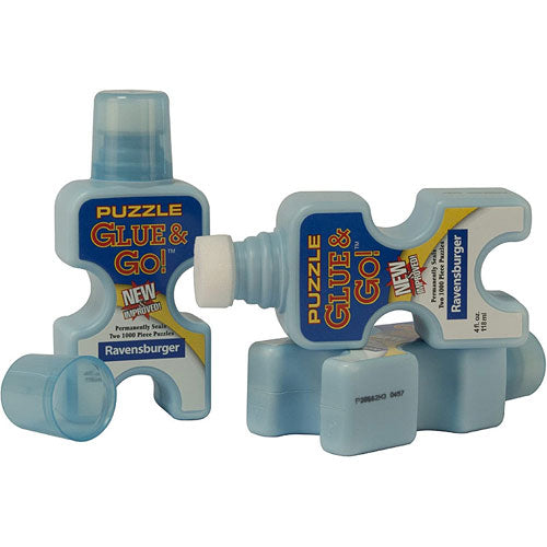 Puzzle Glue & Go! by Ravensburger is a bottle of jigsaw puzzle adhesive designed for securely preserving completed puzzles. The bottle features a unique puzzle piece shape, making it fun and functional. It includes an applicator cap for easy and precise gluing, ensuring no mess while securing your puzzle pieces together.