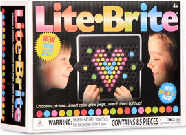 The Mini Lite Brite box features two children happily creating designs with colorful glow pegs. The kit allows for fun light-up art projects with 85 pieces included. It's labeled as a new mini size and suitable for kids aged 4 and older. Warning about small parts for children under 3 years is shown.