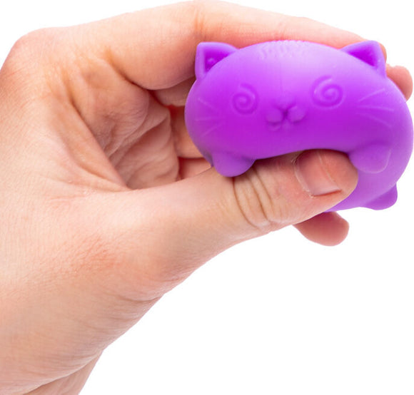 A hand holding a purple, cat-shaped fidget toy. The toy has a soft, squishy texture and an adorable, cartoonish design with facial features like eyes and whiskers. It's perfect for stress relief and sensory stimulation, making it a fun accessory for both kids and adults.