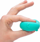A hand holding the Teenie Funky Pups Nee Doh, a squishy, colorful fidget toy shaped like a cartoonish puppy. The toy is teal and has a happy expression, designed for squeezing and relaxation.