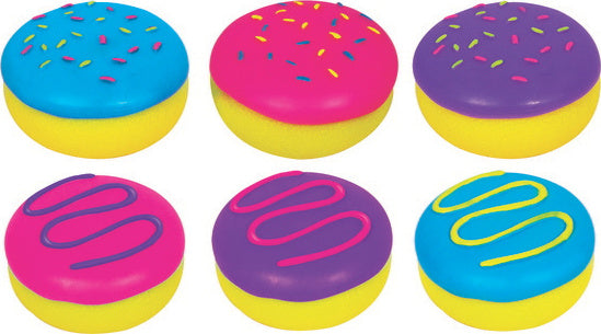 A colorful assortment of Needoh Jelly Donuts fidget toys by Schylling. The image showcases six round, squishy donuts with vibrant pink, blue, and purple icing topped with colorful sprinkles. Each donut is set against a bright yellow base, promoting sensory play and stress relief.