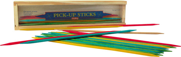 Colorful pick-up sticks scattered around a wooden box labeled 'PICK-UP STICKS' by Schylling. The game features various colored sticks including red, yellow, green, and a natural wooden stick, ideal for family fun and coordination skills.