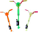 A set of three colorful Spin Copter LED Slingshot Helicopters, featuring bright orange, vibrant green, and neon yellow colors. Each helicopter has a ball-shaped body with wings that spin as they fly, and they incorporate lights for an enhanced visual effect. Ideal for outdoor play and fun activities.