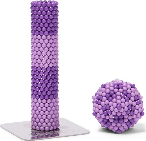 SPEKS Elements: Cumulus. A creative desktop fidget toy featuring a tall, cylindrical stack made of purple magnetic balls, alongside a spherical cluster of the same balls. The smooth surface and varying shades of purple create a visually appealing design, perfect for stress relief and imaginative play.