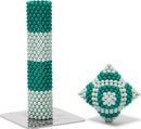 Speks Elements: Marine, a creative and colorful magnetic building set featuring teal and white spheres. The image displays a tall, cylindrical structure made with the spheres alongside a diamond-shaped configuration, all resting on a branded base.