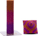 Speks Energize Gradient set featuring a tall, colorful pillar of magnetic beads in gradient shades of pink, purple, and orange alongside a smaller, cushion-like structure made of the same magnetic beads. The base shows the Speks logo, demonstrating the product's visual appeal and creativity in play.