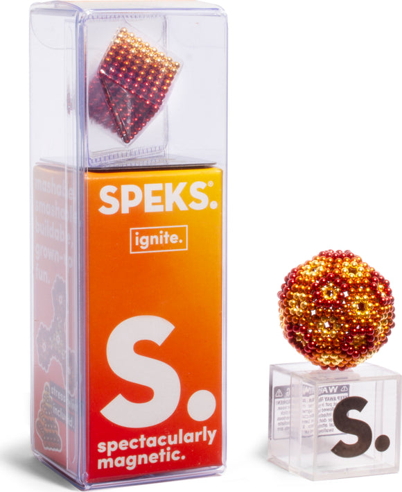 The Speks Ignite Gradient, a vibrant and mesmerizing magnetic building set, features a colorful cube and orb, showcasing its versatility for creative construction. The product is presented in a clear box with an eye-catching orange gradient, emphasizing its playful and innovative nature.