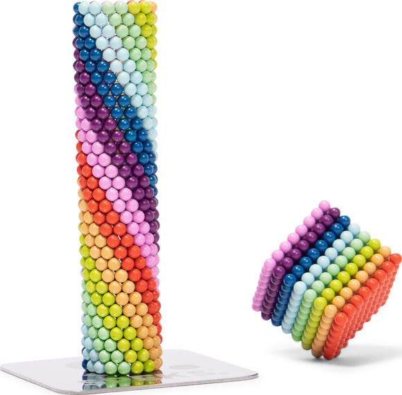Speks: Matte Spectrum, a vibrant stacking toy featuring colorful magnetic balls arranged in a tower and a cube. The toy promotes creativity and sensory play, ideal for both kids and adults.