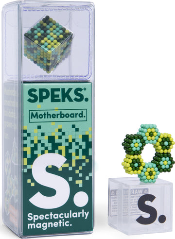 The Speks Pixel Motherboard is a colorful and vibrant magnetic puzzle kit featuring a cube of small, multicolored balls. The packaging is transparent with playful graphics that highlight the product's capabilities for creativity and fun. A unique flower-like shape made of the same balls is displayed beside the packaging, showcasing the imaginative possibilities of this versatile set.