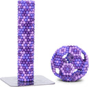 The Speks Pixel 8 Bit consists of vibrant purple and lavender magnetic balls that can be shaped into various structures. The display includes a tall column made from these balls and a spherical shape showcasing creativity and playfulness. Ideal for stress relief and enhancing spatial awareness.