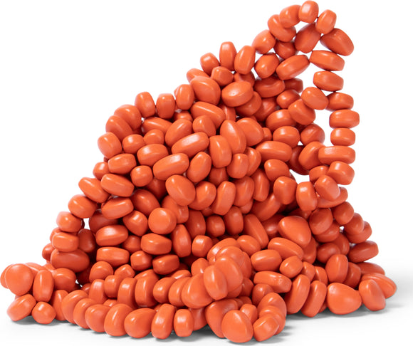 A close-up view of numerous coral-colored, smooth, oval-shaped pieces that are clustered together, showcasing their glossy finish and rounded edges. These pieces convey a playful and sensory experience, ideal for fidgeting or creative use.