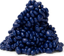 A close-up view of a pile of matte indigo-colored pebbles made from a soft, pliable material. The glossy texture and vibrant dark blue hue create an aesthetically pleasing visual, perfect for relaxation and fidgeting.