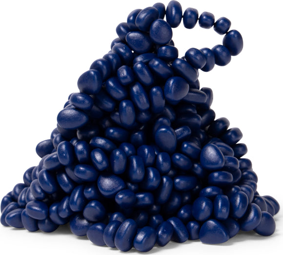A mound of dark indigo-colored spek-like pieces, featuring a variety of smooth, rounded shapes that resemble pebbles. The shiny surface reflects light, creating a visually appealing texture. This unique design invites tactile interaction, making it a stimulating sensory experience.
