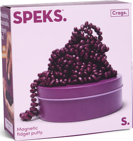 The Crags Matte: Iris by SPEKS is a captivating package featuring a mound of purple, magnetic fidget putty resembling jelly beans, set atop a round purple tin. The vibrant colors invite tactile engagement, perfect for stress relief and endless fidget fun.