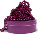 A vibrant purple tin filled with glossy magenta beads spilling out. The design features a playful arrangement of the beads, creating an inviting and fun display. Perfect for fidgeting or stress relief, the Crags Matte: Iris by SPEKS offers a tactile experience for users of all ages.