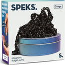 SPEKS Crags: Serenity is a compact tin featuring a mound of black magnetic fidget putty. The putty consists of small, glossy, oval-shaped beads that can be molded and shaped, offering a satisfying tactile experience. The packaging emphasizes the product's ability to provide oddly satisfying, moldable, and fidgety fun.