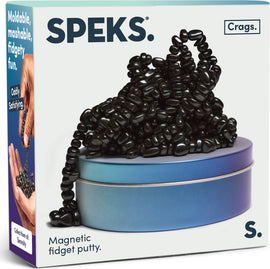 SPEKS Crags: Serenity is a compact tin featuring a mound of black magnetic fidget putty. The putty consists of small, glossy, oval-shaped beads that can be molded and shaped, offering a satisfying tactile experience. The packaging emphasizes the product's ability to provide oddly satisfying, moldable, and fidgety fun.
