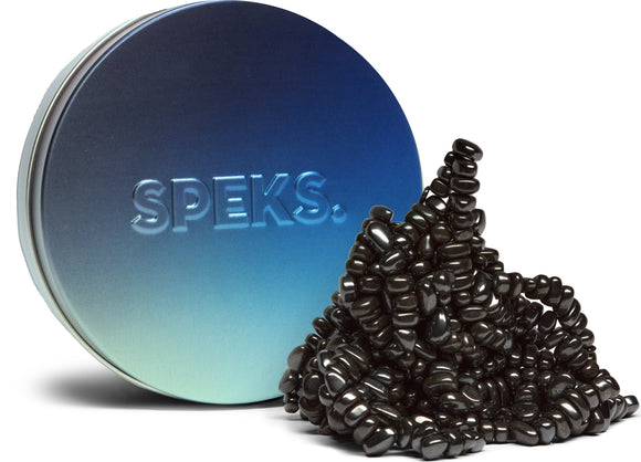 A colorful tin container labeled SPEKS, featuring a mound of flexible and malleable black magnetic pieces spilling out. The container has a gradient design transitioning from blue to silver, showcasing the brand's logo prominently. This item is perfect for stress relief and creative play.