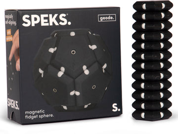The Speks Geode: Snake Eyes is a magnetic fidget sphere featuring a geometric design with contrasting black and white colors. It is presented in an attractive box showing a hand interacting with the product, promoting its satisfying and playful nature.