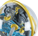 Close-up view of the Perplexus Beast, a mechanical puzzle featuring a clear plastic sphere that houses intricate pathways and obstacles. Colorful blue, gray, and yellow components create an engaging maze for players to navigate a small marble through.