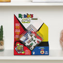 The Perplexus Rubik's Fusion 3x3 game by Spin Master Games features a colorful, intricate mechanical puzzle. It showcases various pathways and obstacles within a clear sphere, emphasizing challenges to navigate through to complete the maze. The packaging displays vibrant graphics, making it eye-catching on shelves, suitable for ages 8 and up.