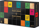 Deluxe Mahjong game box by Cardinal Games featuring colorful tiles with intricate designs and a sleek black background. The packaging highlights the title 'Deluxe Mah Jong' prominently, suitable for ages 8 and up. Ideal for family game nights and enhancing strategic thinking skills.