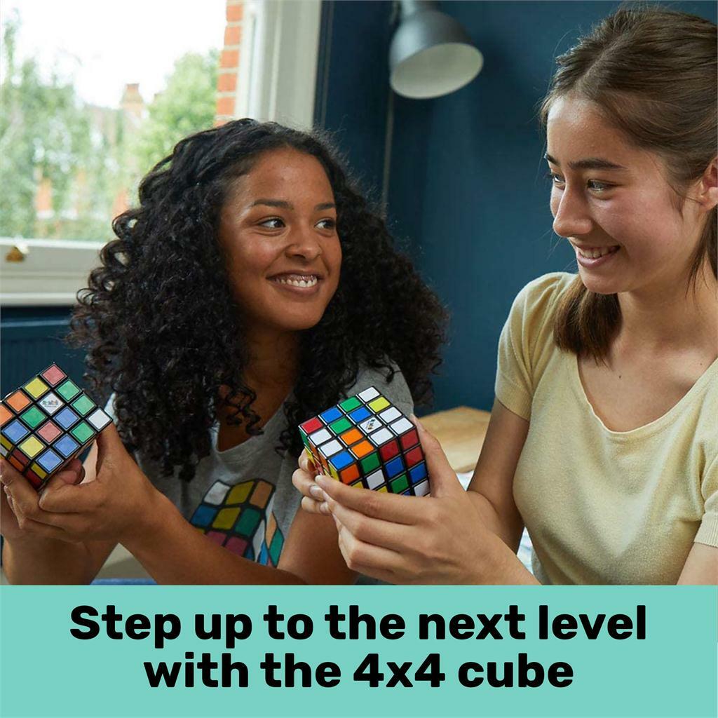 Two young women smile while holding the Rubik's Master 4x4 cubes, showcasing the colorful squares on the cubes as they engage in friendly competition.