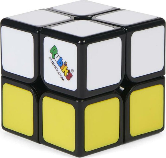 Rubik's 2x2 Apprentice puzzle designed by Spin Master. The puzzle features a glossy black exterior with vibrant white and yellow squares. It is a compact mechanical puzzle ideal for enhancing problem-solving skills and providing hours of entertainment.
