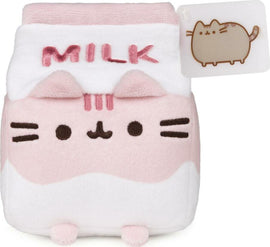 Pusheen Strawberry Milk Sip Plush by GUND. This adorable plush toy features Pusheen in a cute milk carton design, complete with pink and white colors, embroidered facial features, and 'MILK' written on top. Perfect for cuddling or as a collectible item.