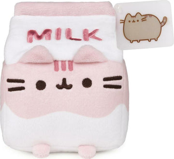 Pusheen Strawberry Milk Sip Plush by GUND. This adorable plush toy features Pusheen in a cute milk carton design, complete with pink and white colors, embroidered facial features, and 'MILK' written on top. Perfect for cuddling or as a collectible item.