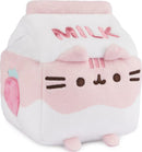 Pusheen Strawberry Milk Sip Plush by GUND, featuring a cute block-shaped plush resembling a milk carton, with a pink and white color scheme, strawberry graphic, and embroidered 'MILK' text.