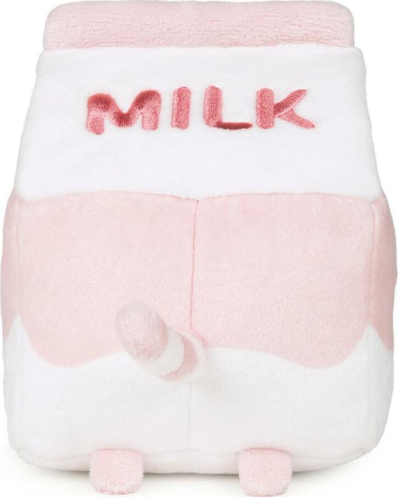 A plush toy shaped like a strawberry milk carton featuring the word 'MILK' in pink embroidery. The toy has a pink and white color scheme with a cute tail and small feet, perfect for cuddling and décor.