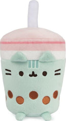 Pusheen Boba Tea Sip Plush by GUND features an adorable plush design resembling a boba tea cup. The plush has a mint green body, pink and white lid with a straw, and cute facial features, along with brown polka dots for a fun touch. Perfect for Pusheen fans and collectors, this soft toy is ideal for cuddling or as a decorative piece.