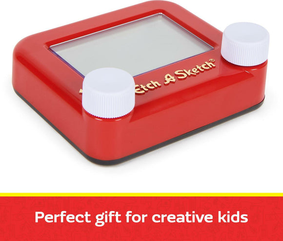 The Pocket Etch A Sketch 2023 by Spin Master features a bright red frame with two white knobs on either side, designed for drawing creative sketches. Ideal for kids, it offers a fun and playful way to express creativity and imagination while helping to develop fine motor skills.