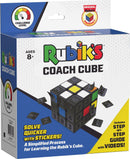 Rubik's Coach Cube packaging features a colorful and visually engaging design. The box showcases the cube with numbered stickers and instructional prompts. The challenge level indicator and age recommendation for 8+ are prominently displayed. Key features include stickers that assist in solving and a mention of a step-by-step guide with videos, highlighting its educational aspect.