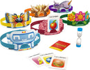 Hedbanz 2nd Edition game by Spinmaster featuring colorful headbands with animal and object designs, a set of identity cards, an hourglass timer, and playful graphics, designed for family fun and guessing games.