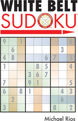 Cover of the White Belt Sudoku book by Michael Rios, featuring a Sudoku grid with numbers filled in from 1 to 9. The title 'WHITE BELT SUDOKU' is prominently displayed in bold black letters, with 'SUDOKU' in red and a logo indicating it is part of a martial arts Sudoku series for beginners. The background is light with soft colors.