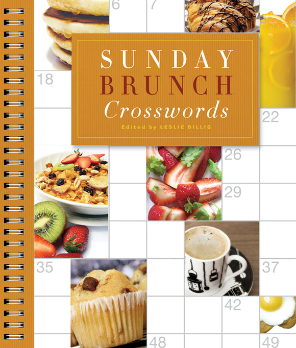 A colorful cover of the book 'Sunday Brunch Crosswords', edited by Leslie Billig. The cover features delicious brunch-themed images including pancakes, fruits, and coffee, surrounded by a spiral binding. The title is prominently displayed in a stylish font against a textured, orange background.
