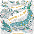 Cover of Millie Marotta's 'Secrets of the Sea' coloring book, featuring a beautifully illustrated whale, octopus, and various fish in vibrant colors with intricate patterns, creating an engaging underwater scene.