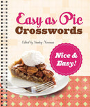 Cover of the book 'Easy as Pie Crosswords' edited by Stanley Newman. The title features playful, bold typography on a light grid background. A slice of pecan pie topped with whipped cream is displayed on a white plate, accompanied by a fork, set against a patterned surface.