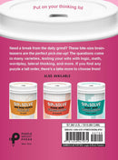 Sip & Solve Two-Minute Brainteasers by Union Square & Co. A colorful display of brain-teasing puzzle cups featuring mini word search puzzles and crosswords. Ideal for quick mental challenges during coffee breaks.