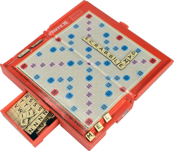 The World's Smallest Scrabble game by Super Impulse features a compact game board with a blue and red layout. It displays letter tiles forming the word 'SCRABBLE' and includes a drawer containing additional tiles, showcasing its travel-friendly design for word enthusiasts.