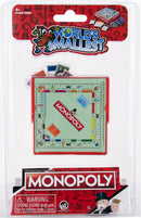 World's Smallest Monopoly game by Super Impulse, featuring a miniature Monopoly board, iconic tokens, and colorful property cards, packaged in clear plastic with a vibrant design.
