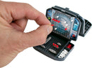 A close-up view of the World's Smallest Battleship game by Super Impulse, featuring a hand placing a red peg on the game board. The game is compact, showcasing a detailed grid with red and white pegs and small battleship pieces neatly stored in the base.